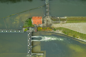 Water management via a water lock in a river in the german landscape next to munich, bavaria.