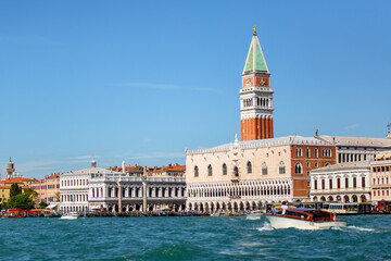 Fototapeta na wymiar Saint Mark's Square and Bell Tower Views on the Venice Skyline from a boat on the Canal 07