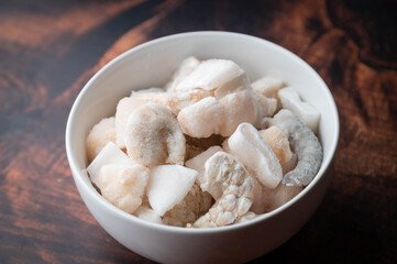 frozen seafood in white bowl
