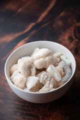 frozen seafood in white bowl