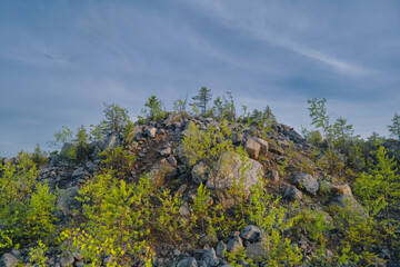Majestic sunset in the mountains forest. Dramatic sky. Ural mountains.