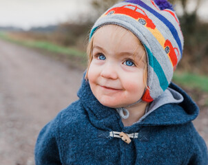 Portrait of happy toddler girl with blue eyes