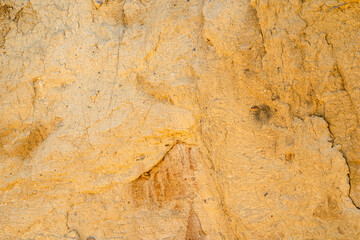 sandstone wall background on seaside cliff, natural erosion