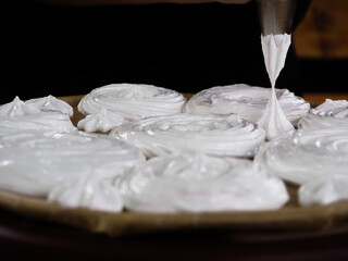 the cook makes meringue from cream.cooking cakes.