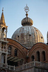 Fototapeta na wymiar Close up of the beautiful Dome of St Mark's Basilica covered in the morning light of Venice 01