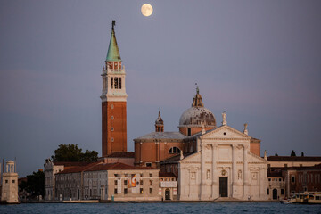Fototapeta na wymiar The Moon Rising Above the Church of San Giorgio Maggiore along the Venice Skyline in Summer