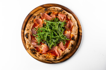 italian oven pizza with tomatoes, rucola and parsma ham