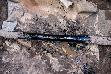 gas pipe in resin. Resin-treated pipe treated with resin.
