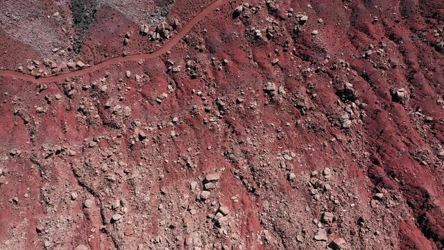 Aerial view of a car on a cliff of a Utah canyon