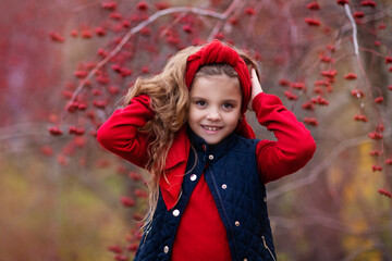 girl in red in the autumn forest