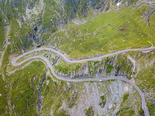 Transfagarasan road is one of the most spectacular mountain roads in the world. Beautiful long and curvy road viewed from a drone.