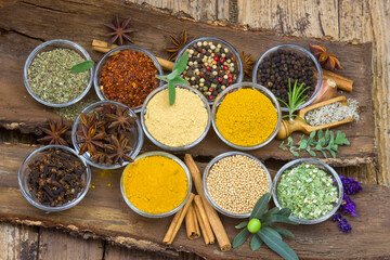 Variety of spices on wooden background