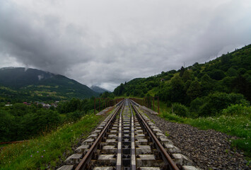 railway in the mountains. Mountains in clouds. Journey begins