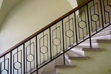 Old stairs with iron handrail in old estate