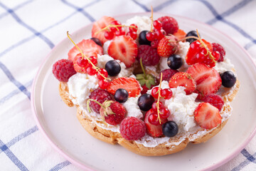 dessert with fresh berries on a white background. Sweet roll