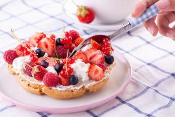 dessert with fresh berries on a white background. Sweet roll