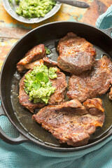 Pork shoulder in white wine with broad beans & herbs pesto