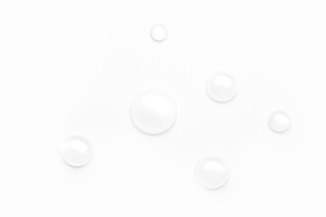 drops of water on a white background, top view