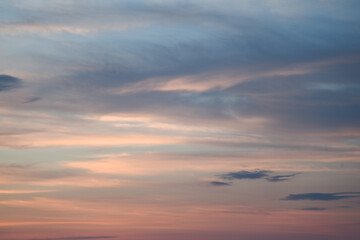 Naklejka na ściany i meble Delicate shades of the evening sky by the bay