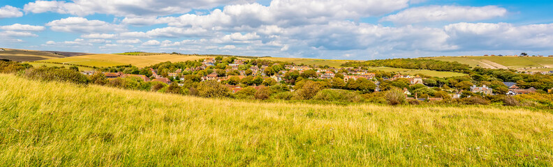 A panorama view from Beacon Hill across the town of Rottingdean, Sussex, UK in summer