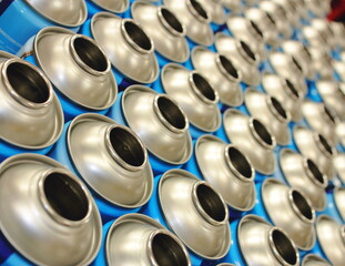 blue aerosol cans in rows