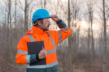 Forestry technician posing in forest