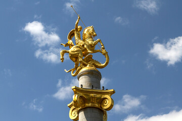 Fototapeta na wymiar Statue of St. George and the dragon in Freedom Square, Tbilisi, Georgia