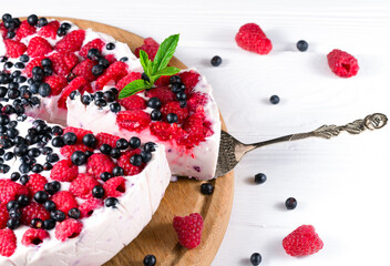 raspberry cake and many fresh raspberries
