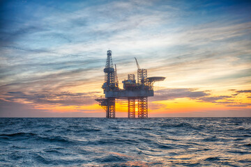 Offshore oil rig at sunset