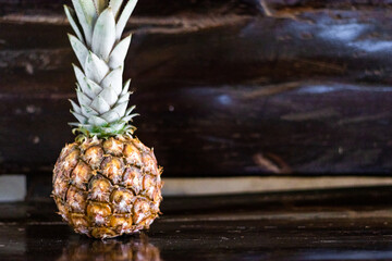 pineapple at a wooden bench