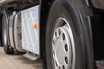 Front wheel with disc cap of semi-truck trailer european type close-up.