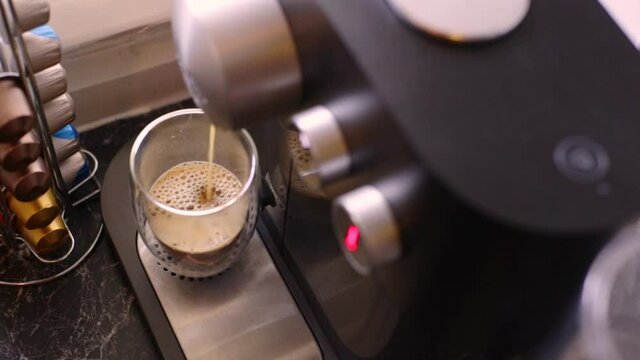 Delicious coffee being made in kitchen