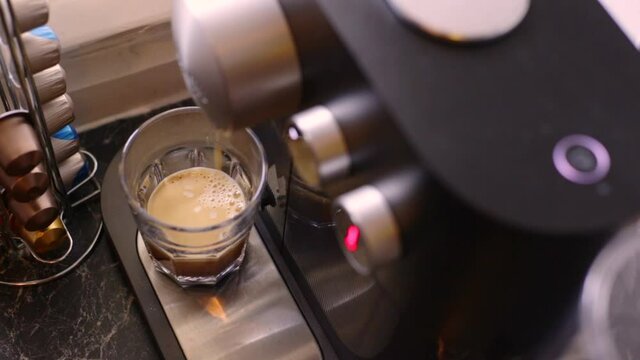 Delicious coffee being made in kitchen