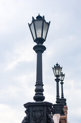 Fototapeta na wymiar Classic style city lamppost at sunset, close up