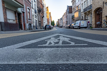 Pedestrian crossing sign on deserted streets in Europe