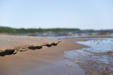 On the sandy shore of the bay