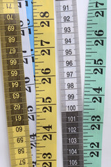 Measuring tape set on white background. Gren white blue measuring tape