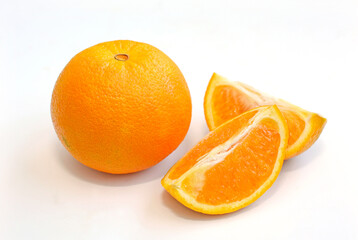 Orange and two slices on a white background