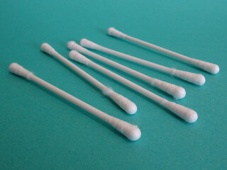 Plastic cotton sticks in blue background