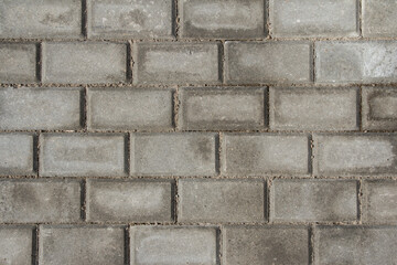 Background from paving slabs. Stone tiles on the sidewalk. Footpath.