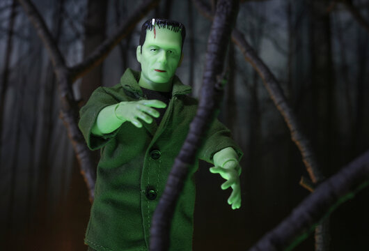 NEW YORK USA - OCT 21, 2018: MEGO Corp Frankenstein Monster action figure walking through a haunted forest
