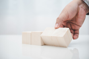 worker hand switch wood cube block