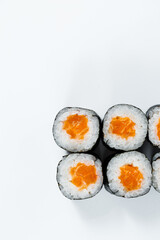 Rolls with red fish, fresh rice with salmon wrapped in nori.