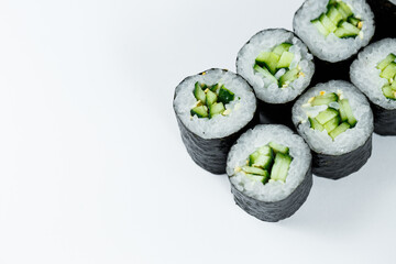 Japanese food. Rolls with ripe cucumber, fresh rice with vegetables in nori. Vegetarian rolls