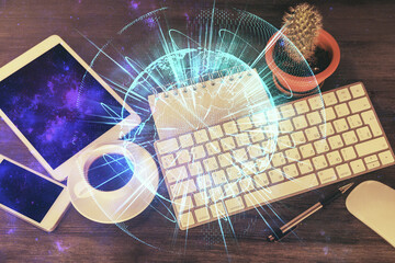 Double exposure of business theme hologram over desktop with phone. Top view. Mobile international trade connection concept.