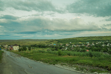 rural landscape with houses and road,
village landscape with rural houses
