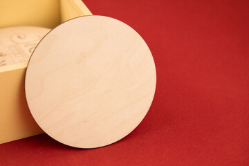 decorative wooden circle shape tool Christmas holidays gift red vivid color background empty copy space for your text
