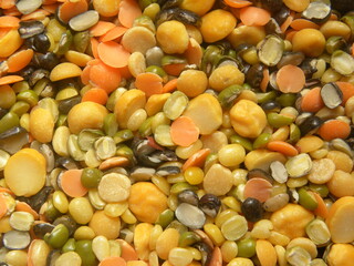 Many different types of colorful raw split lentils
