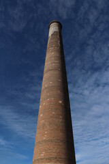 old brick chimney La Ramona on a blue sky at old mining town El Triunfo, Mexico 