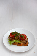 sandwich with cutlet lettuce and tomato slices